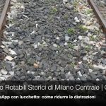 binari e pietrisco del deposito rotabili storici con titolo del video in sovrimpressione